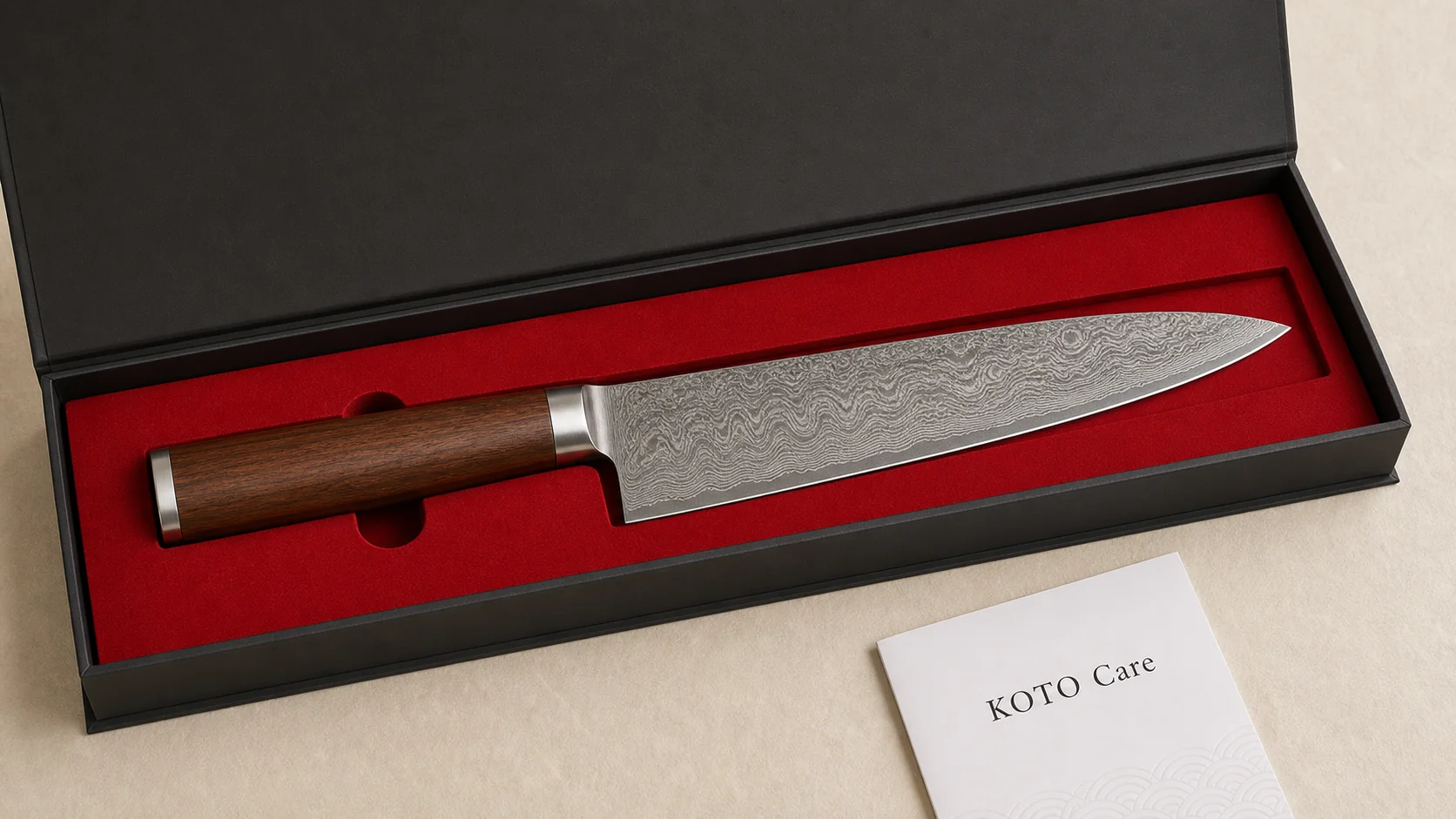 Open KOTO knife presentation box with red interior and care card